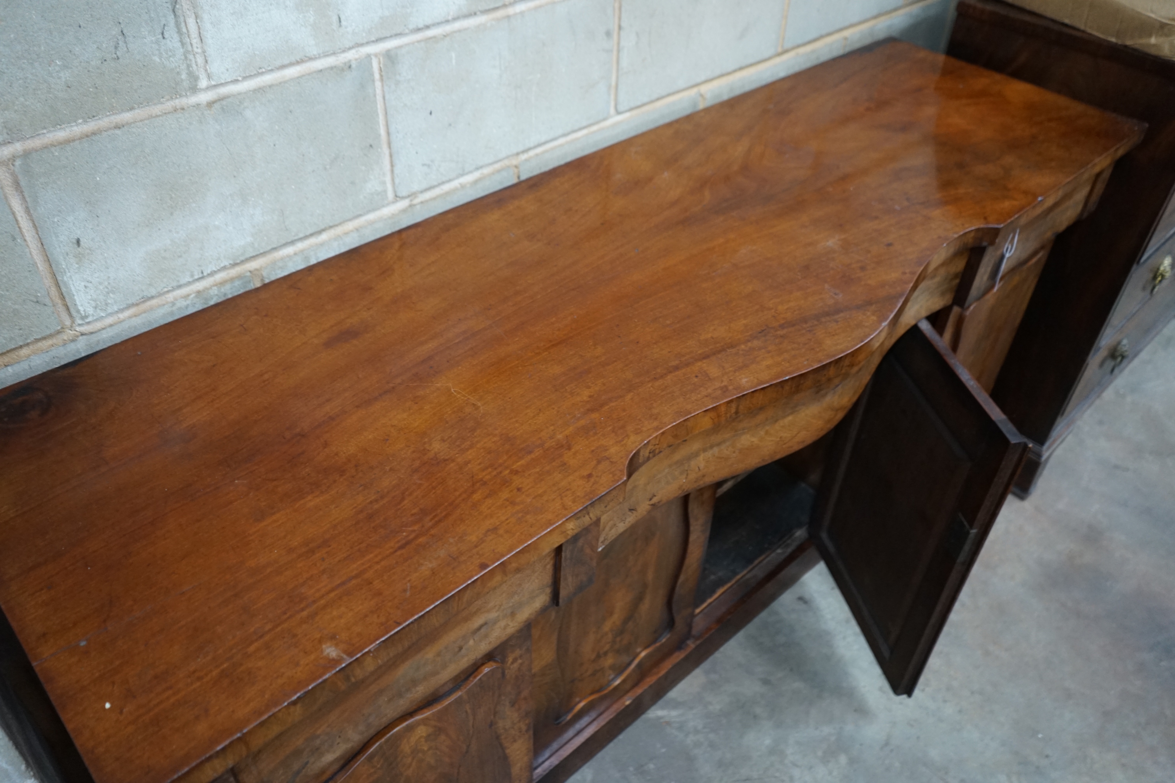 A Victorian mahogany serpentine sideboard, width 182cm depth 54cm height 93cm